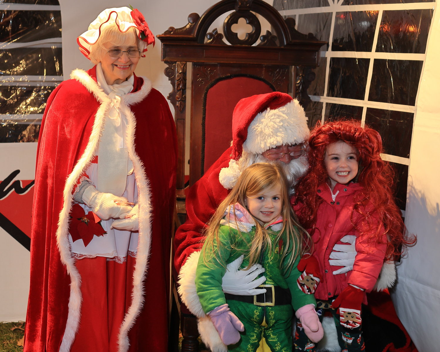 Santa and Mrs. Claus greet children in Honesdale’s Central Park following the annual Santa Parade.
